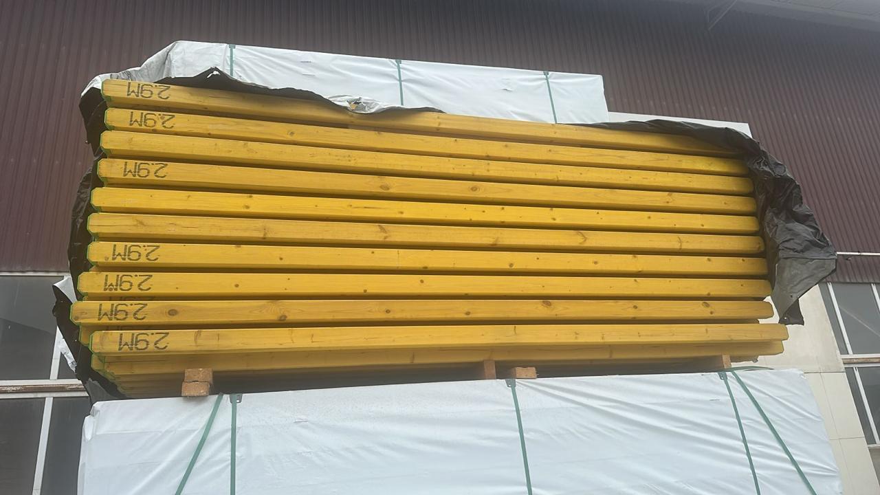 Horizontal bundle of Kingwood structural timber beams in storage